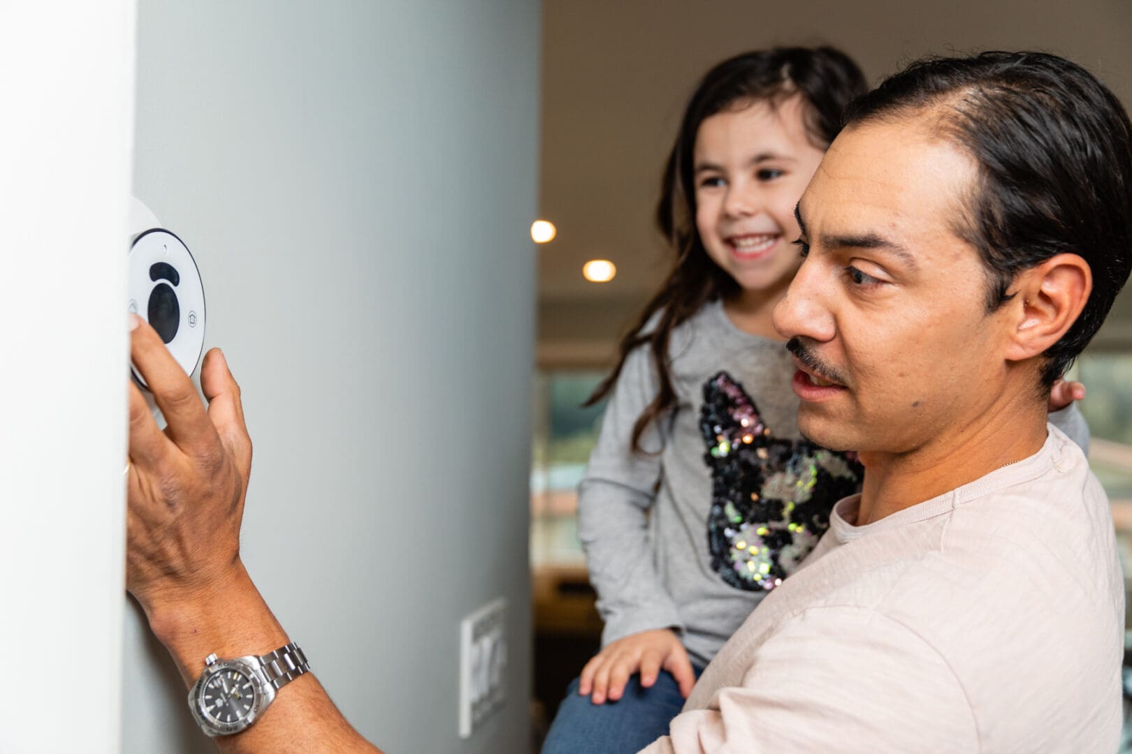 A man and his daughter looking at the camera.